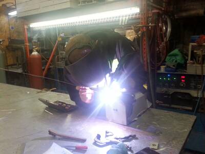 Clean public restroom sinks and mirrors, related to Buy America standards at VandalStop.